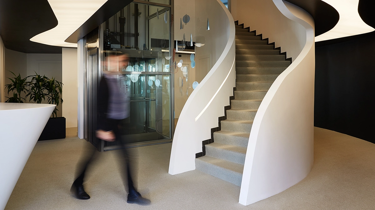 Reception area with spiral staircase at the BKN301 office
